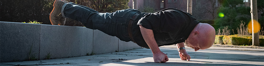 mark wood performing a press up